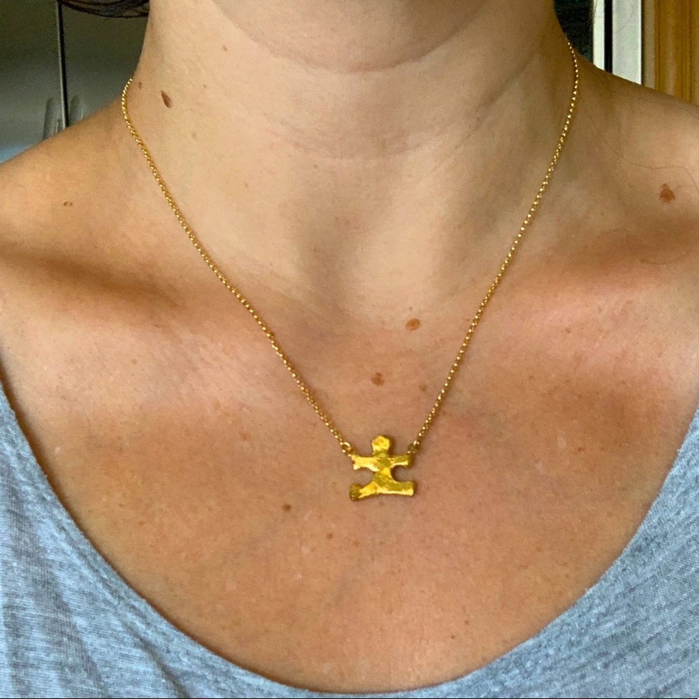 Yellow gold puzzle piece necklace for autism awareness